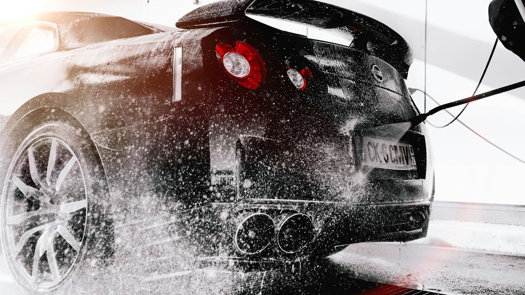 Grayscale photo of black car