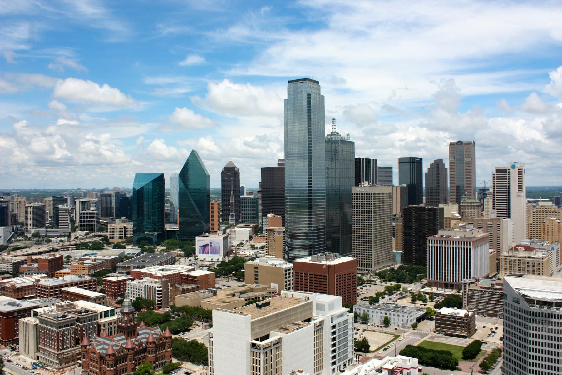 Dallas, TX — City buildings under blue sky during daytime